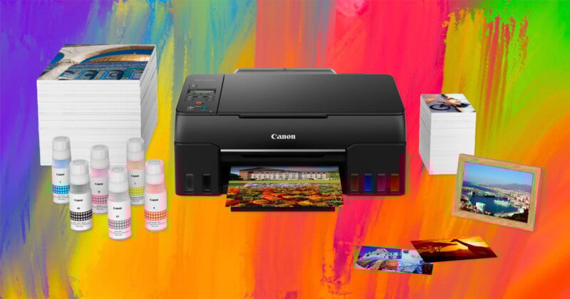 A Canon printer surrounded by ink bottles, stacks of printed photos, loose photo prints, and a framed photo, all set against a bright, colorful gradient background.