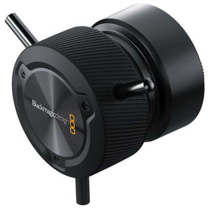 Close-up of a Blackmagic Design camera accessory with a sleek black metal finish, two protruding handles, ribbed grip, and branded logo on the end cap.