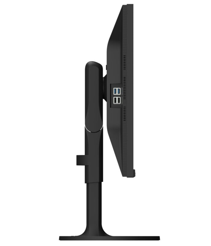 A black computer monitor viewed from the side, showing a thin screen, a sturdy stand, and four visible USB ports on the side of the monitor frame against a white background.