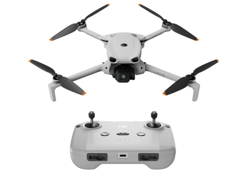 A gray quadcopter drone with a camera on the front is shown above its matching handheld remote controller with dual joysticks and buttons, against a white background.