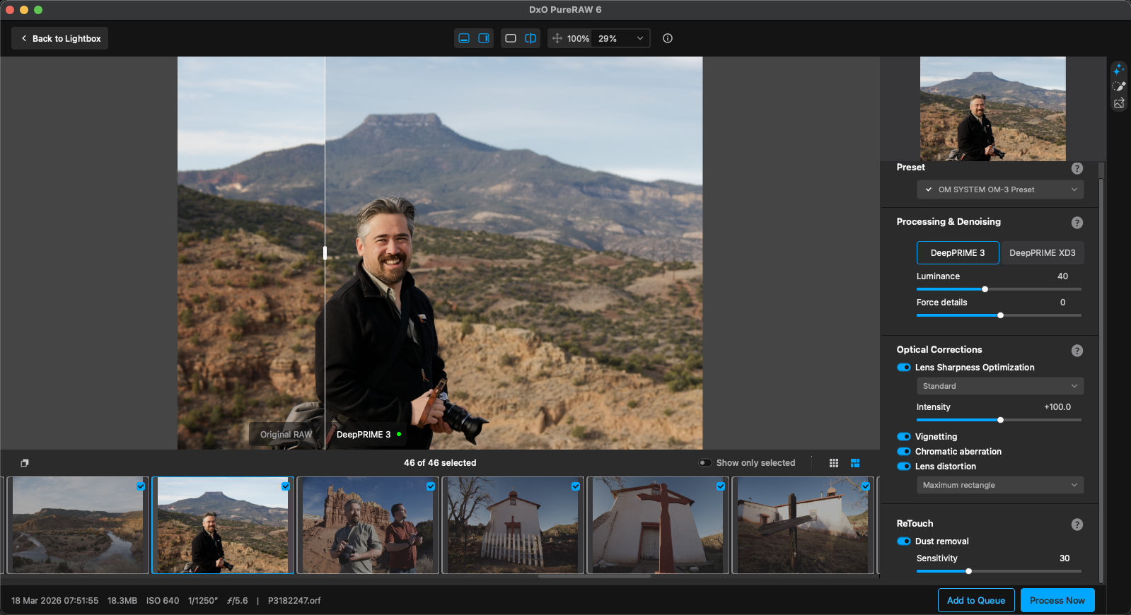 A man holding a camera stands outdoors in a mountainous landscape, smiling at the camera. Editing software tools and adjustment sliders are visible on the right side of the screen.