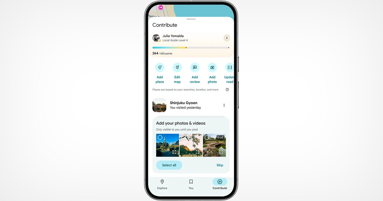 A smartphone displaying the Google Maps contribution screen, showing user contributions, points, options to add a place, edit map, add photos, and upload roads, along with photo suggestions at the bottom.