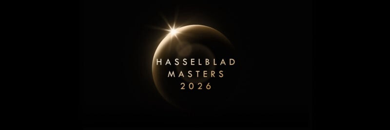 A glowing golden crescent with a starburst effect appears on a black background. The text "Hasselblad Masters 2026" is centered in elegant gold letters over the crescent.