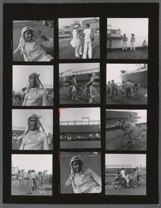 A black-and-white contact sheet with twelve photos showing people, mostly men, relaxing, talking, and riding bicycles outdoors on a boardwalk or rooftop. One man with a headscarf appears in several images.