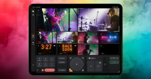 A tablet displays a live video production interface with multiple camera views of musicians performing on stage, along with control buttons and countdown graphics.