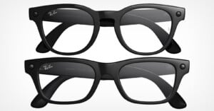 Two pairs of black Ray-Ban eyeglasses are shown, viewed from the front and the back, featuring clear lenses and a thick, classic frame design.