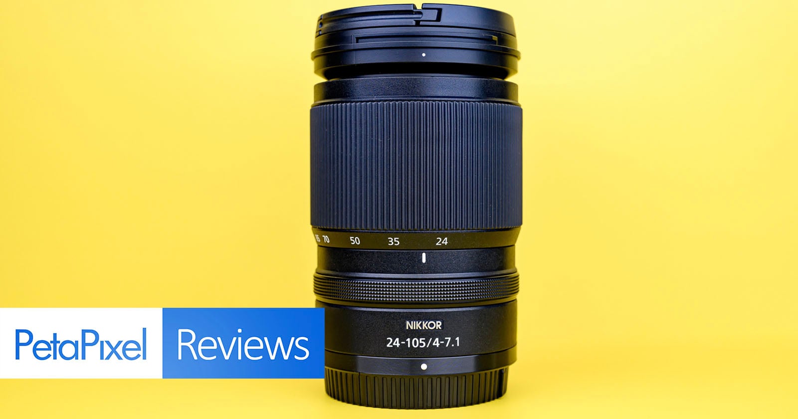 A Nikon Nikkor 24-105mm f/4-7.1 camera lens stands upright against a bright yellow background, with a "PetaPixel Reviews" banner in the lower left corner.