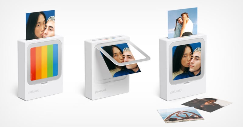 Three white Polaroid-style photo printers print colorful photos of people. One shows a rainbow design, another prints mid-process, and the third displays printed photos on and around it.