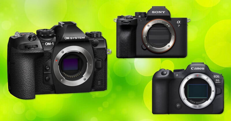 Three digital cameras—OM System, Sony Alpha, and Canon EOS—are displayed against a bright green, blurred background. Each camera has its lens removed, revealing the image sensor.