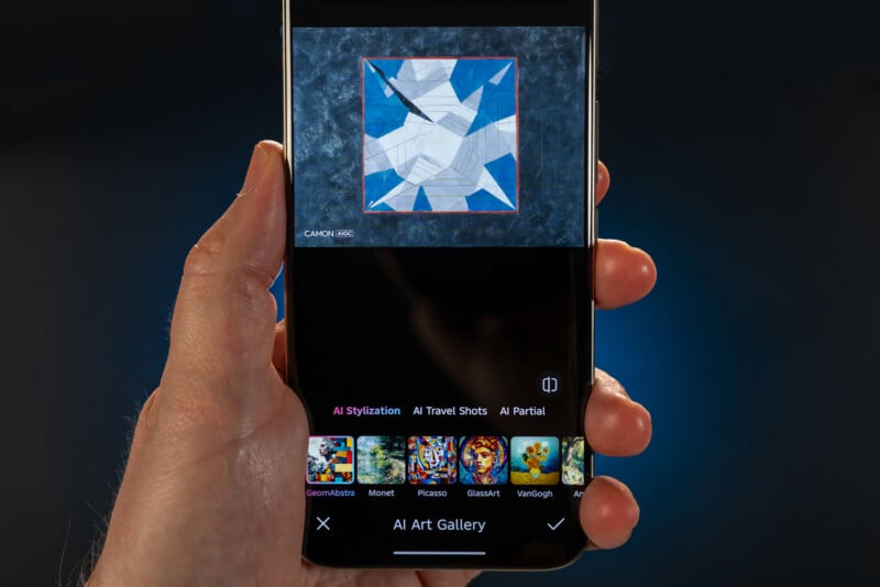 A hand holds a smartphone displaying an art app with an abstract geometric artwork on screen. Below the artwork are filter options named after famous artists like Picasso, Monet, and Van Gogh.