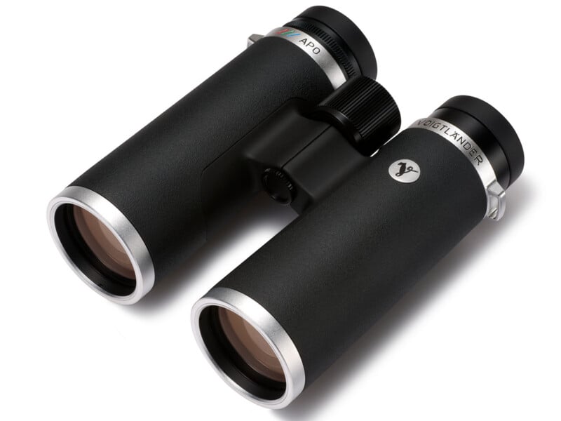 A pair of black and silver binoculars with textured grips, labeled " VOIGTLÄNDER," shown on a white background.