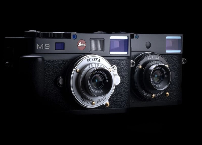 Two black Leica M9 cameras with "Eureka" limited edition lenses are displayed side by side against a black background, highlighting their classic design and details.