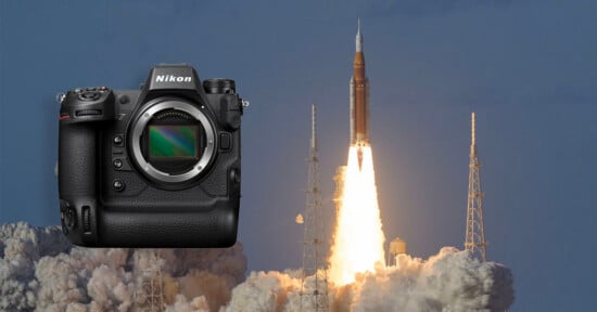 A Nikon camera is superimposed over a photo of a rocket launching into the sky, with bright flames and smoke billowing from the rocket at liftoff.