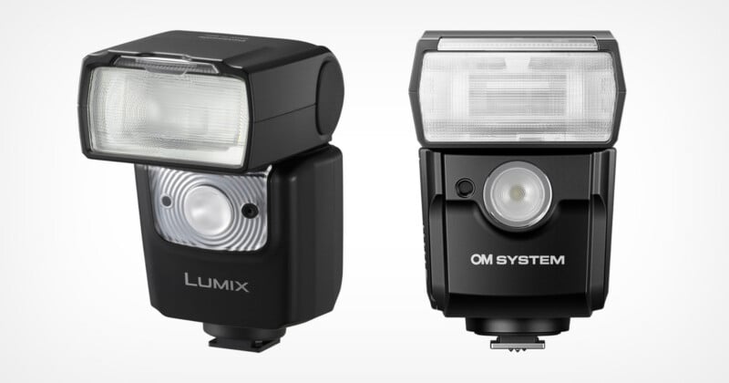 Two external camera flashes are shown side by side against a white background. The left flash is labeled "Lumix" and the right flash is labeled "OM System." Both are black with rectangular flash heads.