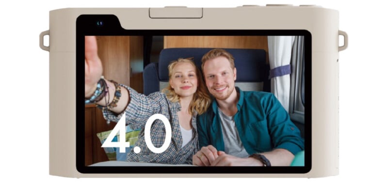 The back of a digital camera shows a screen displaying a smiling couple taking a selfie together, with the number "4.0" overlaid on the image.