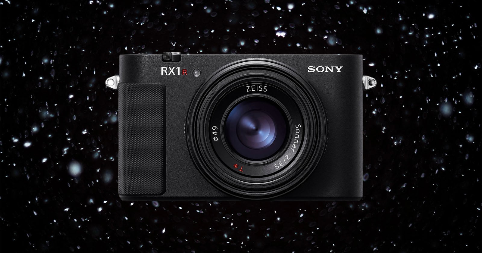 A Sony RX1R camera with a Zeiss lens is shown centered against a dark background with white specks resembling falling snow or stars.