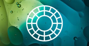 A white circular grid icon with evenly spaced segments is centered on a blue-green abstract background featuring bubbles and organic shapes.