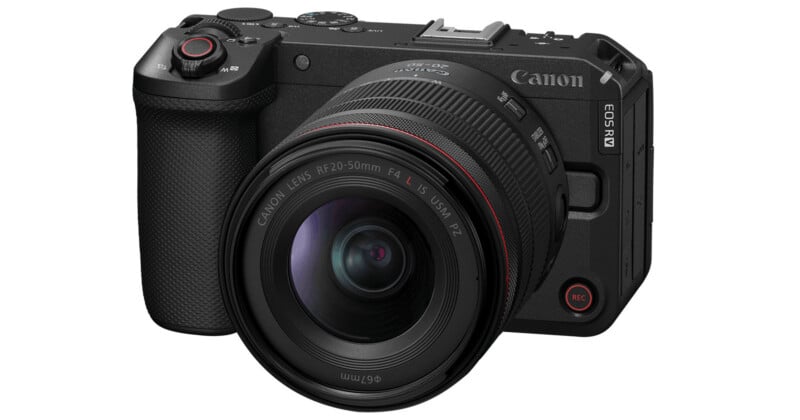 A black Canon EOS R8 mirrorless digital camera with a large RF 24-50mm f/4-6.3 IS lens attached, shown at a three-quarter angle on a white background.
