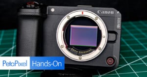 A Canon EOS R camera body without a lens is displayed on a green cutting mat, showing the sensor. "PetaPixel Hands-On" is overlaid in the lower left corner.