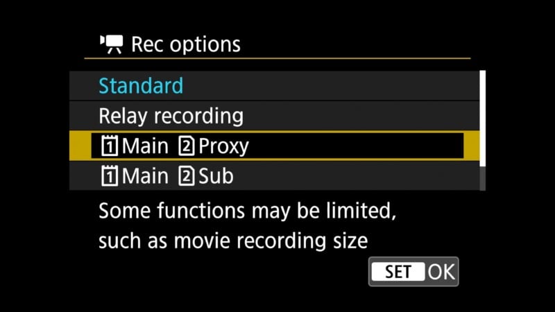 Camera screen showing "Rec options" menu with choices: Standard, Relay recording, Main/Proxy, and Main/Sub. A note below states some functions may be limited, such as movie recording size. "SET" and "OK" buttons at bottom.