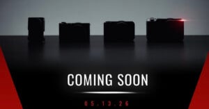 Four silhouetted cameras on a dark background, with one emitting a small red light. Text below reads "COMING SOON" and "05.13.26" in white and red on a black and red gradient background.