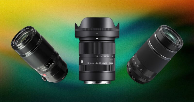 Three camera lenses are displayed against a colorful gradient background, with one lens upright in the center and the other two tilted on either side, showcasing different sizes and designs.
