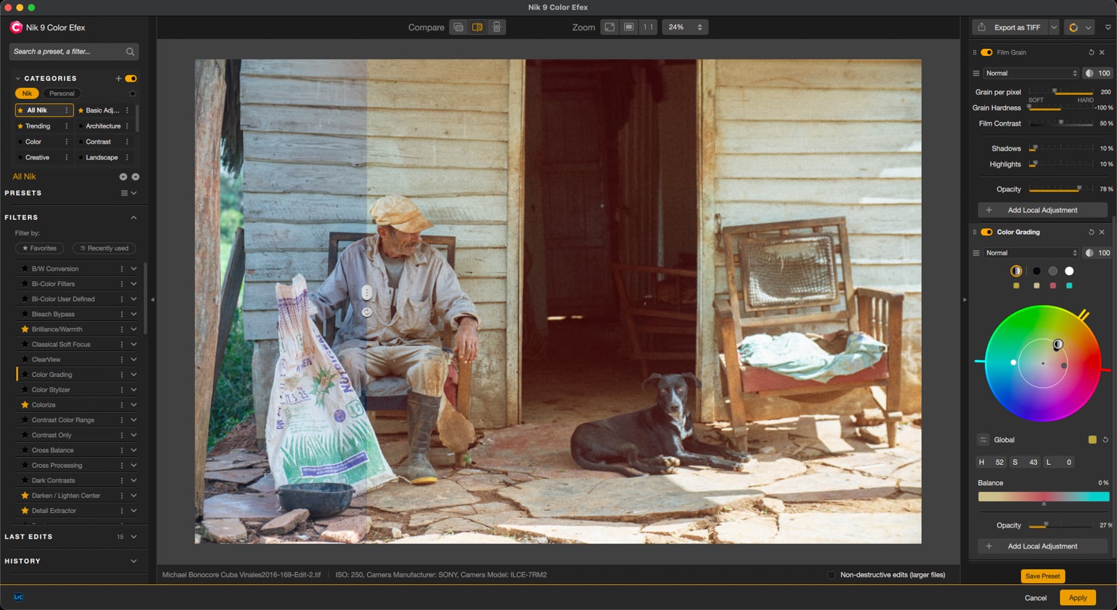 An elderly man in a cap sits on a porch next to a black dog, surrounded by bags and worn furniture, in front of a rustic wooden house. The scene is viewed through a photo editing software interface.