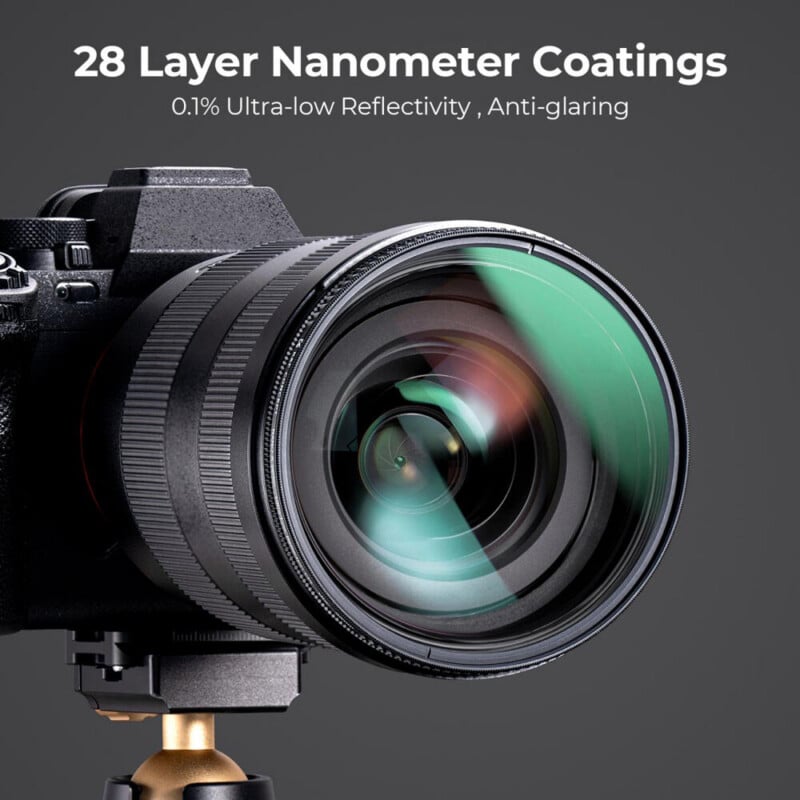 Close-up of a camera lens on a tripod, highlighting the multi-coated glass. Text above reads "28 Layer Nanometer Coatings, 0.1% Ultra-low Reflectivity, Anti-glaring" on a dark background.
