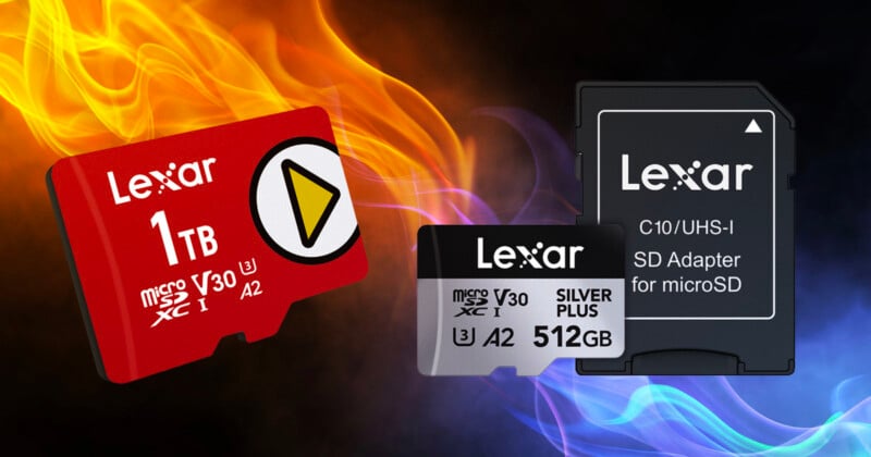 Three Lexar memory cards are shown: a red 1TB microSD card, a silver 512GB microSD card, and a black SD adapter for microSD, with blue and orange flames in the background.