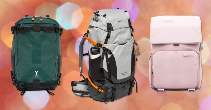 Three backpacks are displayed side by side: a green backpack with black straps, a gray hiking backpack with orange accents and a water bottle pocket, and a light pink backpack, all set against a pink and orange blurred background.