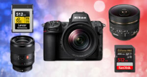 A Nikon Z series camera is centered, surrounded by two camera lenses and two 512GB memory cards from Lexar and SanDisk on a red, white, and blue blurred background.