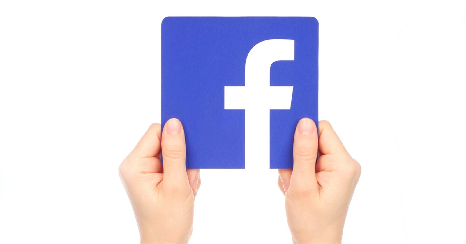 Two hands hold a blue square card featuring the white lowercase "f" Facebook logo against a plain white background.