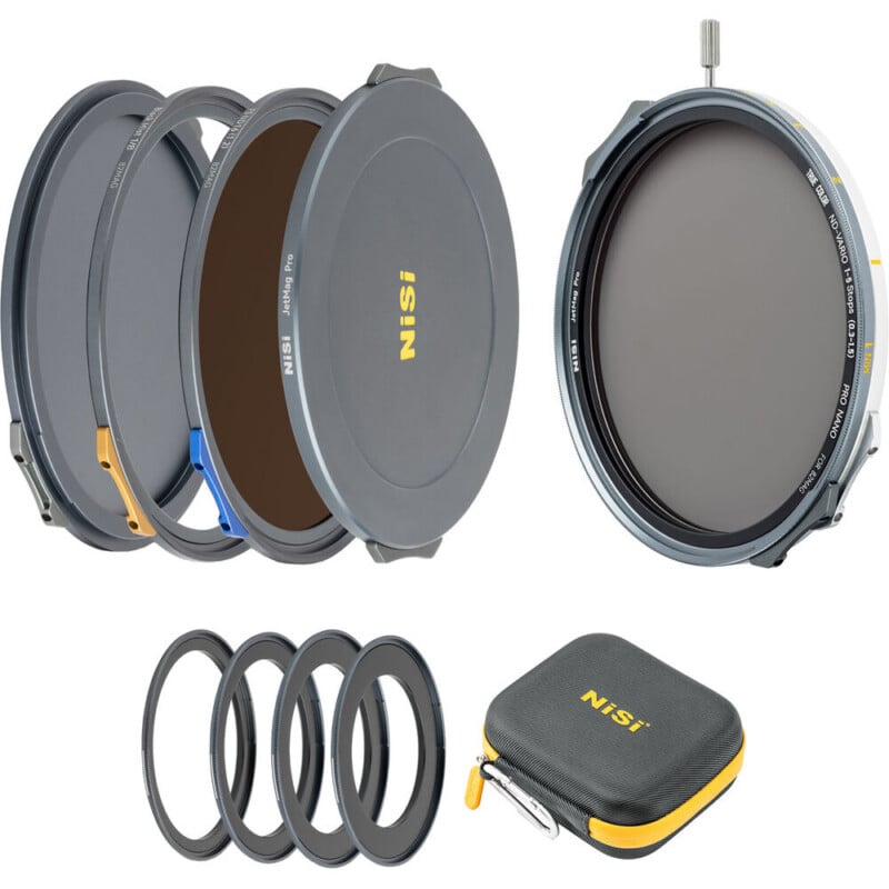 A NiSi lens filter kit displayed with four circular filters, adapter rings, a metal filter holder, and a small zippered carrying case, all arranged on a white background.