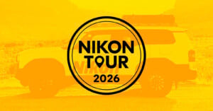 A yellow-tinted image of an SUV in the background with a circular logo in the center that reads "Nikon Tour 2026.