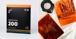 A box of OptiColour 200 4x5 color negative film is on the left. On the right, two developed film negatives and a camera lens are placed on a white surface.