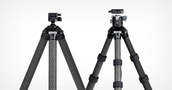 Two carbon fiber tripods with black legs are shown standing side by side against a white background. Each has a different style of tripod head mounted on top.