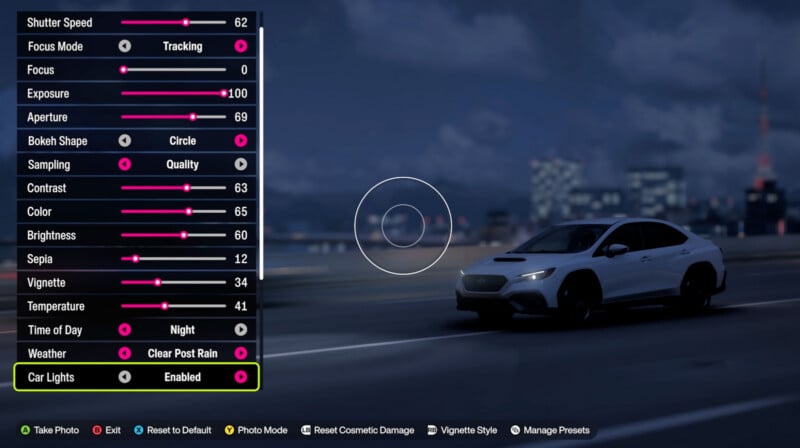 A white car is parked on a road at night with a blurred cityscape in the background. Camera setting options, such as shutter speed and exposure, are displayed on the left side of the screen.