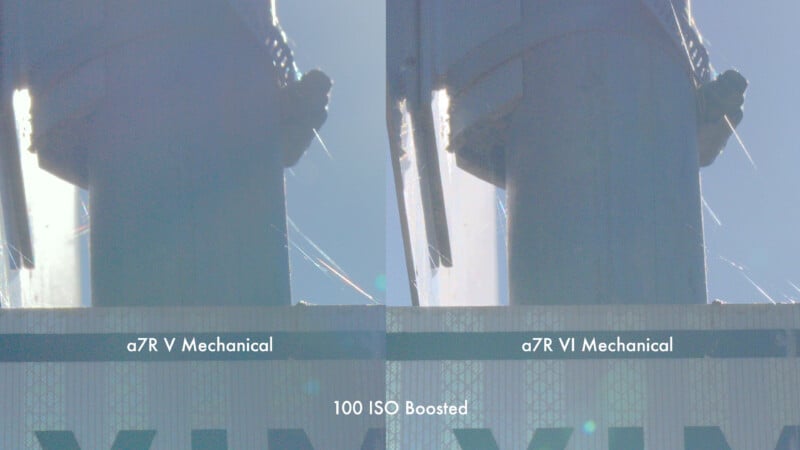 Side-by-side comparison of two photos labeled “a7R V Mechanical” and “a7R VI Mechanical,” showing a backlit pole, web strands, and a sign with “100 ISO Boosted” text below. Both images are overexposed.