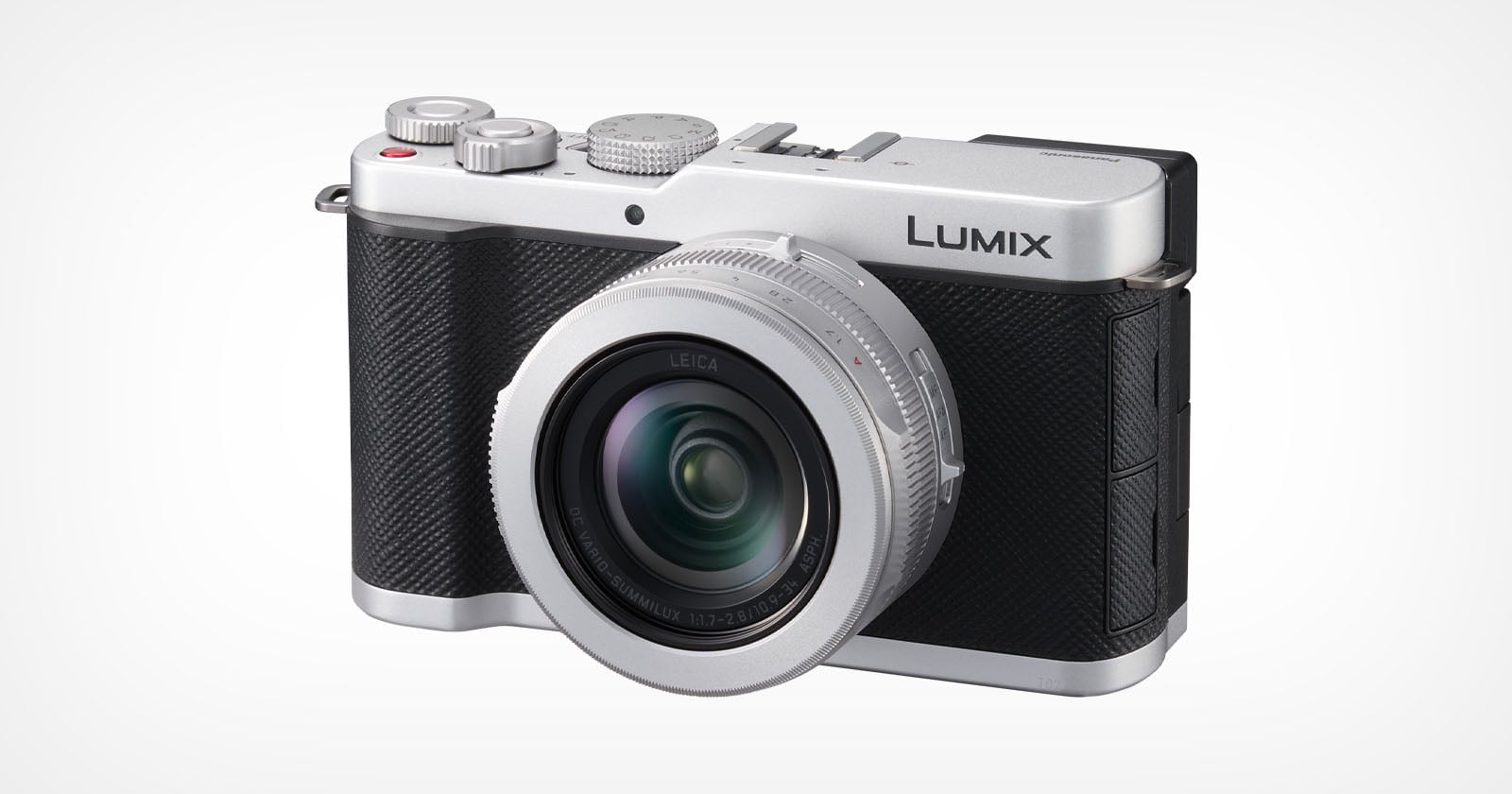 A silver and black Lumix digital camera with a large lens facing forward, positioned against a plain white background.