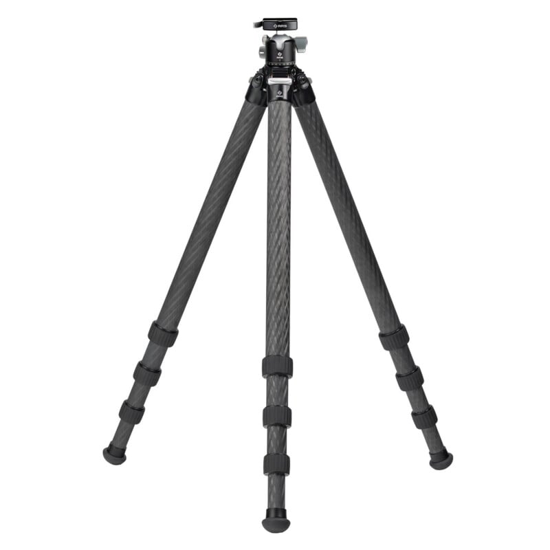 A black, three-legged camera tripod with adjustable legs and a mounting plate at the top, standing on a white background.