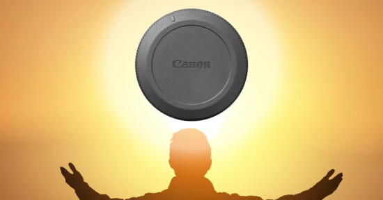 A silhouette of a person with arms raised stands in front of a glowing orange sky, with a Canon lens cap positioned above their head, resembling a halo or the sun.