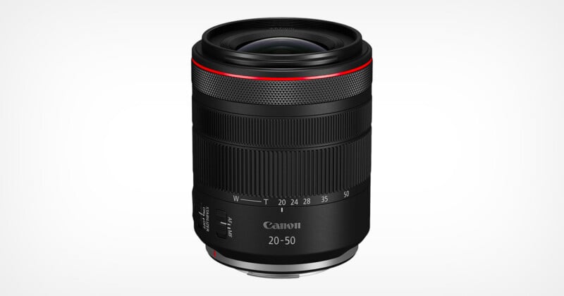A black Canon RF 20-50mm camera lens with a red ring near the top, textured focus and zoom rings, and white focal length markings, displayed against a plain white background.