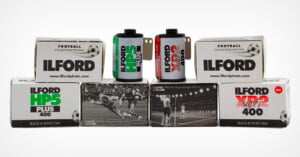 Six boxes and two rolls of Ilford black and white film, labeled as football collectors edition, are arranged in two rows. The boxes feature vintage football match photos and different Ilford film types.