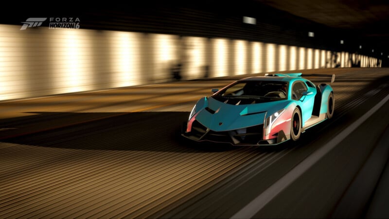A teal and pink Lamborghini with a large rear wing speeds through a well-lit tunnel in the video game Forza Horizon 4, with motion blur emphasizing its speed.