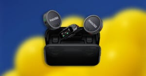 A set of Insta360 wireless microphones and receiver displayed atop an open charging case, with a blurred blue and yellow background.
