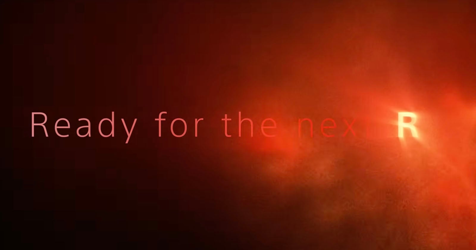 Text on a dark red, smoky background reads "Ready for the nex" with a glowing, highlighted letter "R" at the end, partially obscured by bright light.