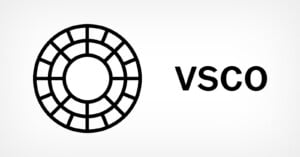 Black and white circular geometric logo with grid lines next to the bold text "VSCO" on a plain white background.