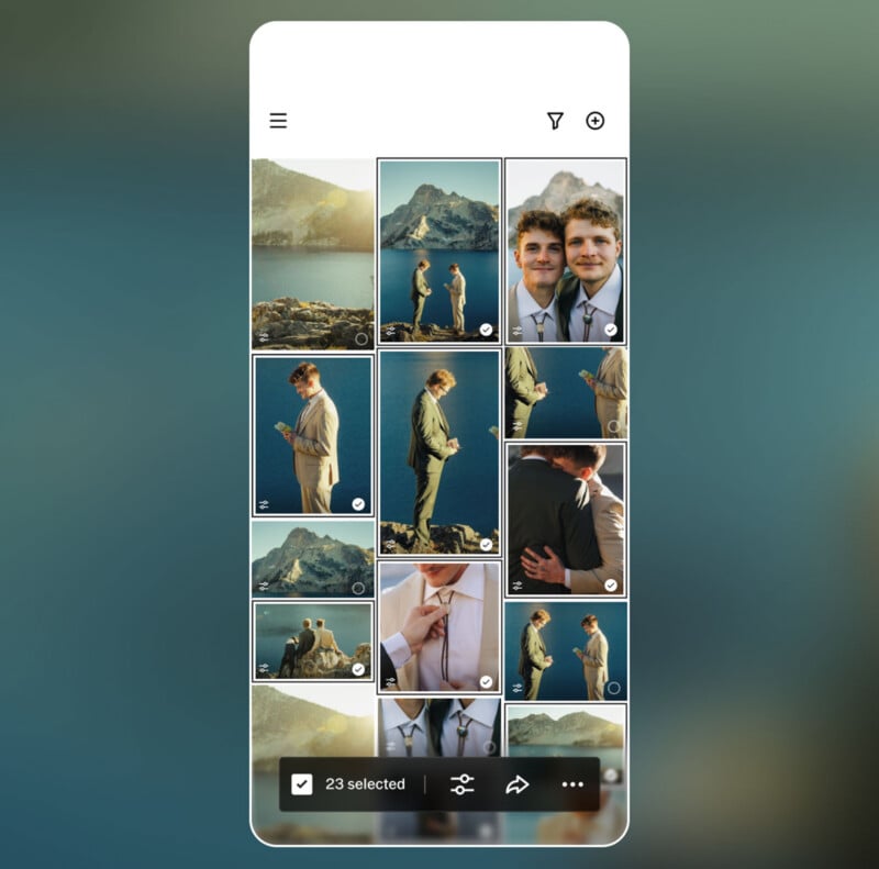 A smartphone screen shows a photo gallery with images of two men in suits by a lake and mountains, embracing, smiling, and standing together; 23 photos are selected at the bottom.