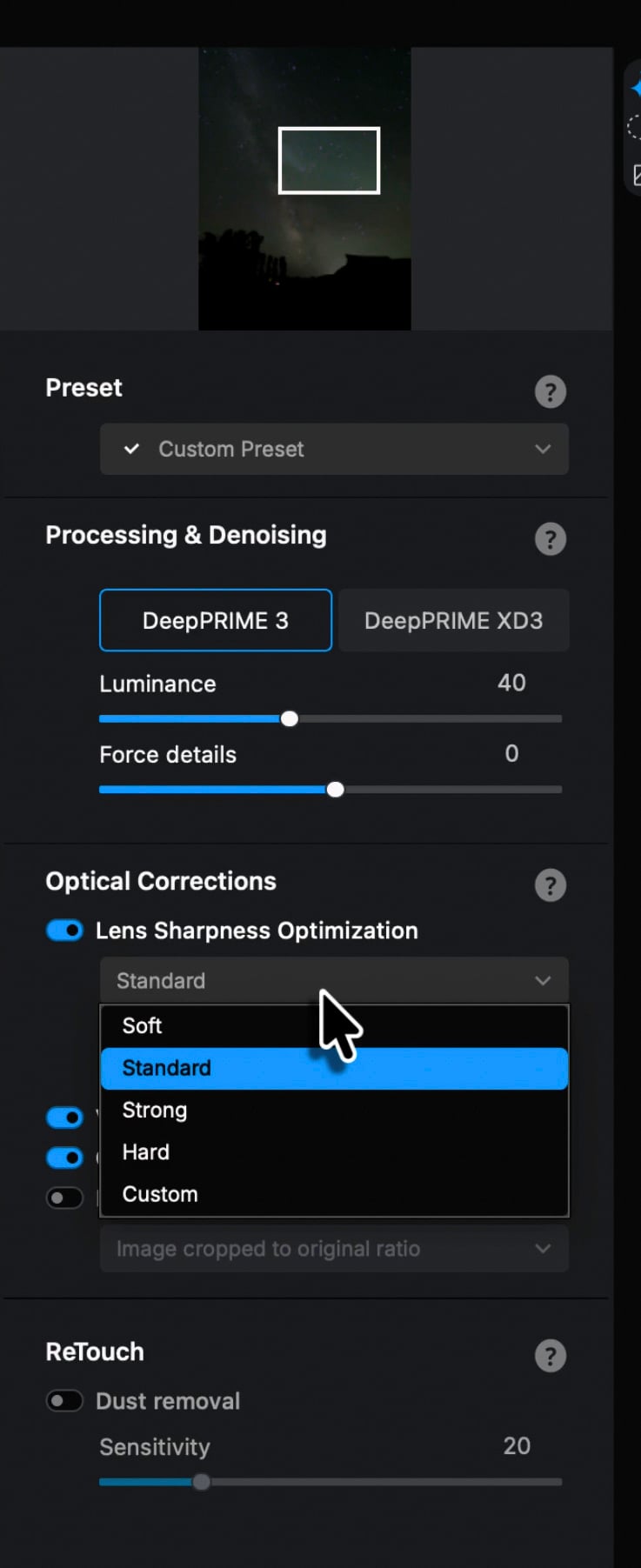 A photo editing software interface displays settings for denoising, lens sharpness optimization with "Standard" selected, and retouching options. A cursor points to the "Standard" sharpness setting.