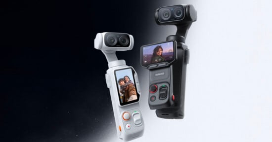 Two handheld 3D cameras, one white and one black, each with a touchscreen displaying selfies, stand side by side against a gradient black-to-white background. Both have dual lenses and control buttons.